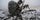 A hunter backpacking across a snowy mountain.