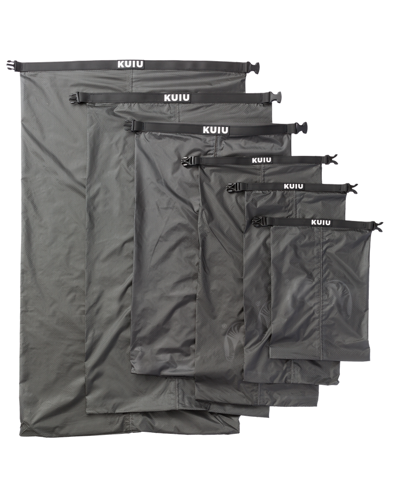 Picture of all six sizes of Roll Top Dry Bag in Stone color laid out flat