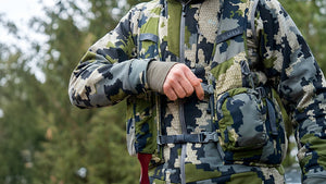 Turkey hunter wearing the Rival Turkey Hunting Vest in Verde Camoufouage