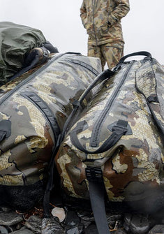 Close-up of two Kodiak Submersible Duffel bags, visibly wet, highlighting their waterproof material