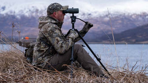 Male hunter glassing in head to toe KUIU.