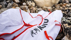 KUIU Boned Out Game Bags on top of rocks near the harvested animal.