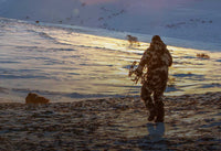 Back of Hunter Sneaking into Archery Range on Musk Ox Wearing Kutana Gale Force Jacket and Pants Vias Camouflage
