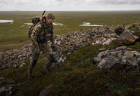 Front, Angled View of Kevin Wilkerson Hiking Up Hill Wearing Valo Camouflage