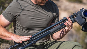 Person wearing Vital S1 Crew holding a scope in an outdoor setting