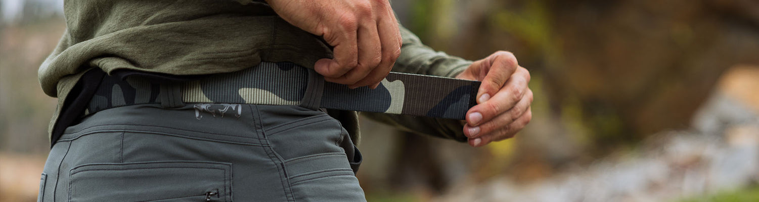 Close-up of Hunter adjusting his hunting belt
