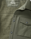 Close-up shot highlighting front snap buttons and left side chest pocket on Blockfield Fleece Shirt Jacket in Dark Sage Green
