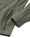 Close-up shot of snap buttons on cuffs and zippered hand pocket on Blockfield Fleece Shirt Jacket in Dark Sage Green