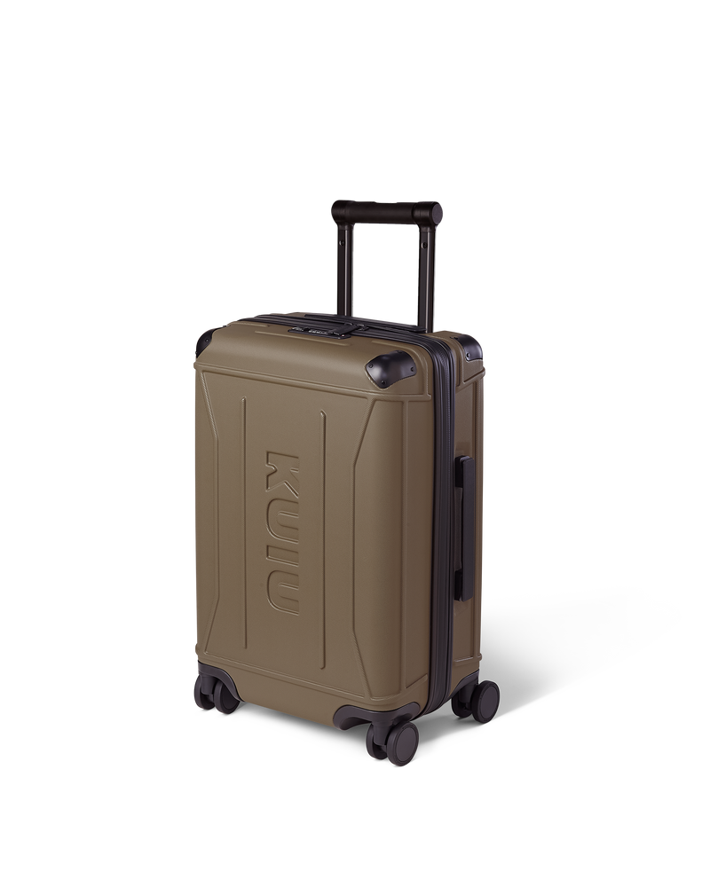 Angled view of Hardline Spinner Carry-On in Bourbon Brown, shown with handle down.