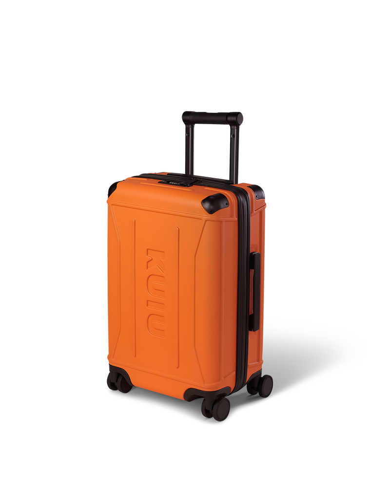 Angle view of Hardline Spinner Carry-On in Orange, shown with handle down.