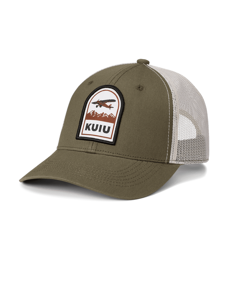 Front of Bush Plan Mesh Back Hat with patch of bush plan flying over mountains and KUIU logo on Black front panels an off white mesh back panels