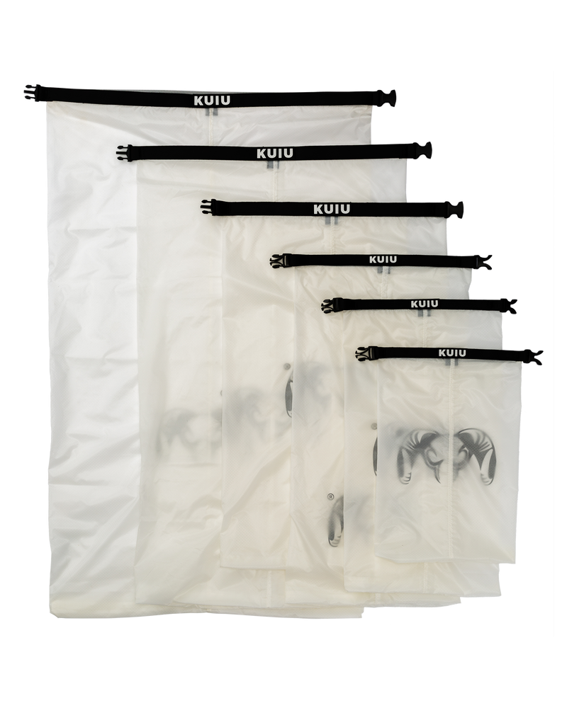 Picture of all six sizes of Roll Top Dry Bag in Clear color laid out flat