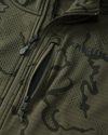 Close-up view highlighting front unzipped left chest pocket and half Zip-T feature on Ridgepoint Fleece Hoodie in Olive Green Tonal Pattern