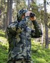 Hunter Glassing in Green Wooded Area with Super Down LT Vest in Verde Camouflage
