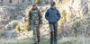 Two young boys walking alongside each other while wearing the Youth Attack Pant and Youth Reversible Versa Jacket.