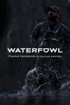 A man in Veros camouflage waders stands in shallow water, splashing through ripples, with large white text reading 'WATERFOWL' and smaller text below that says 'Hunting flooded timber, reeds, frag, and cattails.'.