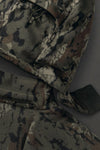 Close-up of a detached hood of the KUIU Proximity Hooded Insulated Jacket in Veros camouflage, showing the textured fabric and a zipper detail.
