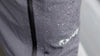 Close-up detail of water droplets on the Northridge Rain Pant in Gunmetal Grey, Highlighting the waterproof material and full-length side zipper