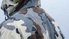 Rear, Angled View of Hunter Wearing Chugach TR Rain Jacket in Vias Camouflage Highlighting K-DWR Treatement to Repel Water
