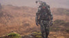 Front of Brendan Burns Hiking Through Storm in Kutana Gale Force Jacket and Pants in Verde Camouflage
