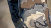 Detailed View of Kutana Stretch Woven Pants in Vias Camouflage Highlighting BEMIS overlay Film to Reinforce Key Seams