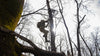 Lower View of Hunter Climbing into Treestand Wearing Valo Camouflage