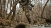 Front, Angled View of Hunter Hiking Creek Bottom Wearing Proximity Insulated Pants in Valo Camouflage