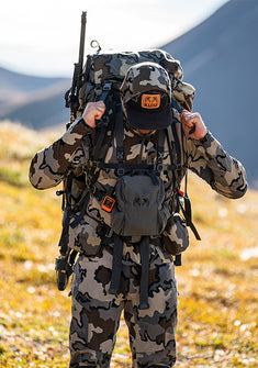 Front view of hunter fully equipped in KUIU's Vias Camouflage Pattern hunting apparel