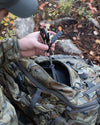 Aerial, Front View of Pro 6000 Pack in Valo Camouflage Highlighting Front YKK Zippered Storage Pocket with Accessory Clip