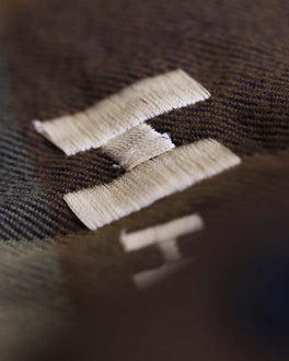 Closeup view of fabric being embroidered.