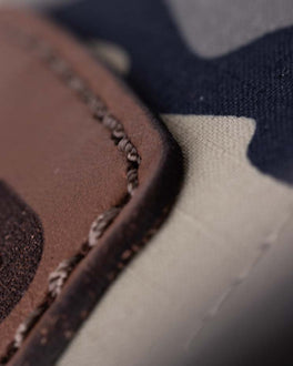 Close up view of a patch being sewn onto fabric