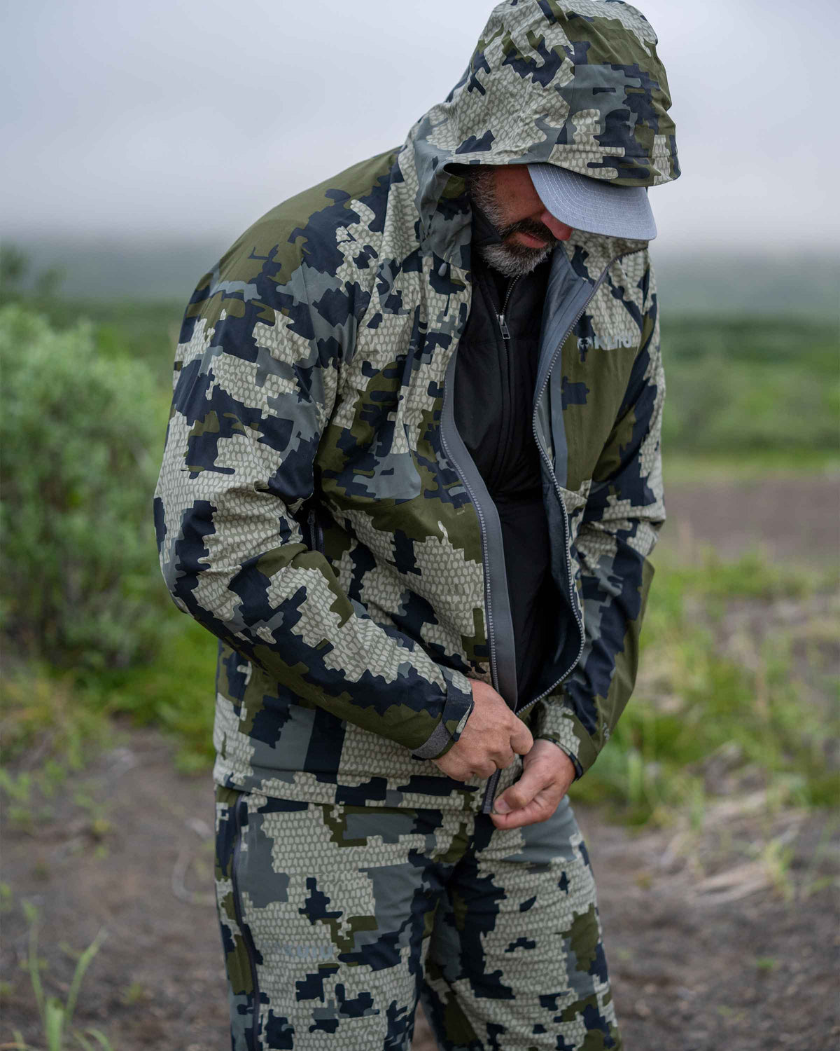 lightweight rain gear for backpack hunting KUIU Chugach TR Rain Hunting Jacket in Verde