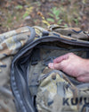 Stalker PRO 500 in Valo Camouflage being clipped into a larger pack's main compartment
