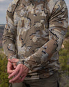 Hunter in Gila Long Sleeve Crewneck Shirt in Valo, showing thumbhole on the left sleeve